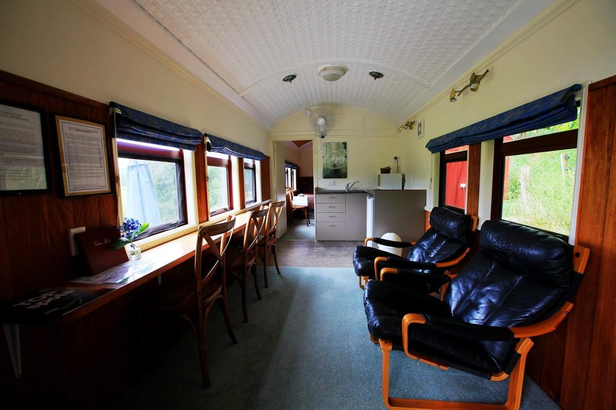The interior lounge of the railway carriage unit at Woodlyn Park