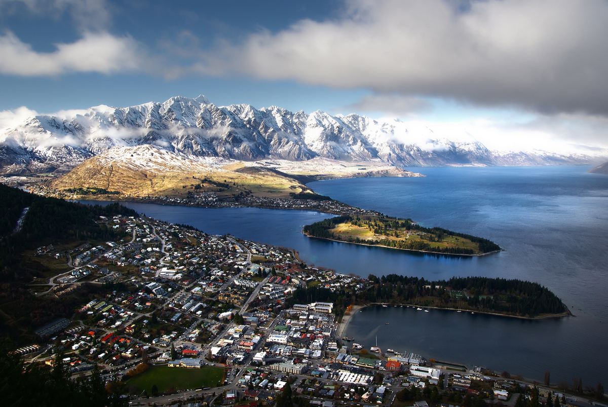 Queenstown and Lake Wakatipu at golden hour, mountains behind