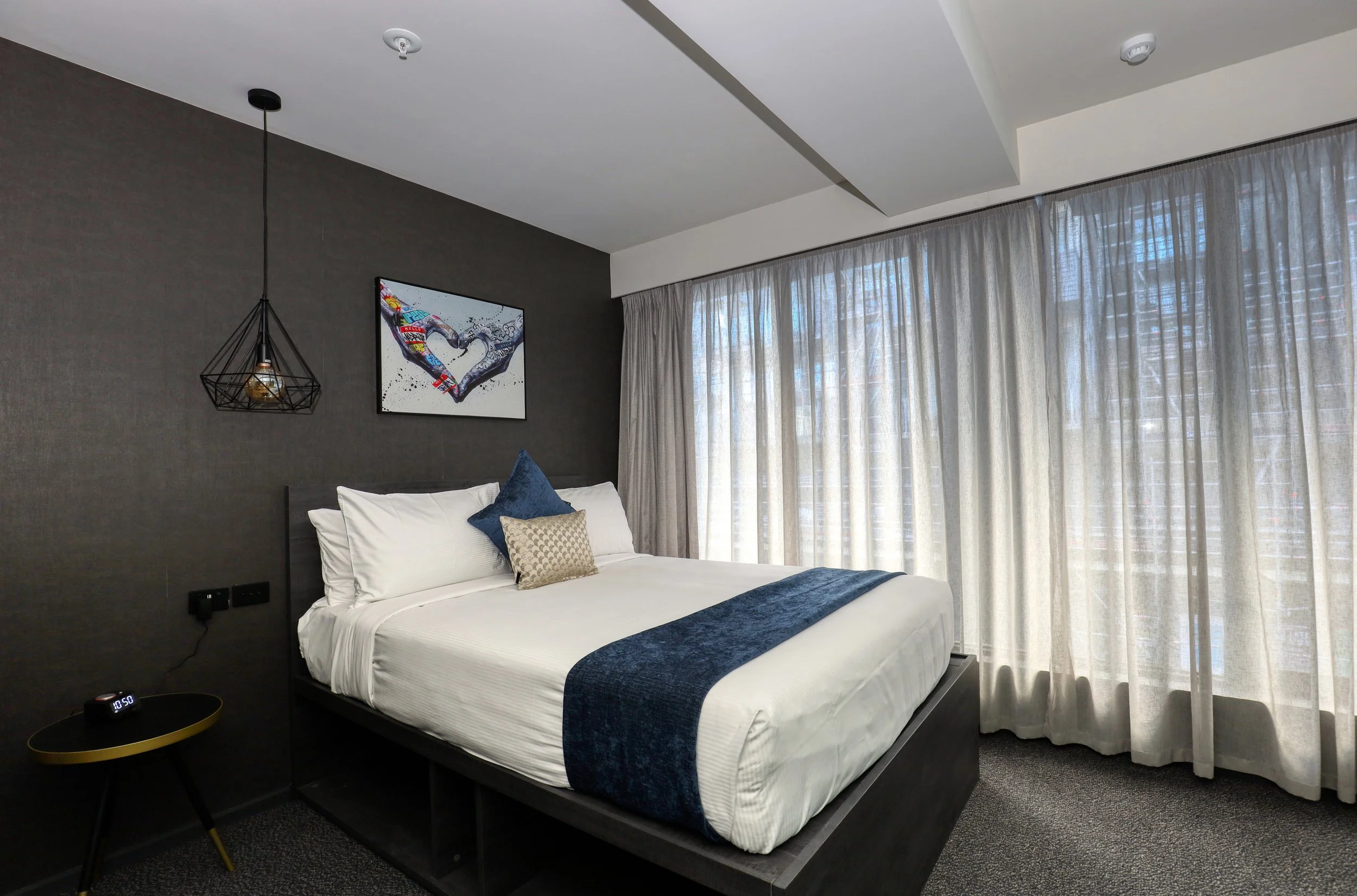 The Viv Hotel Deluxe Queen Room, bright and spacious with generous natural light